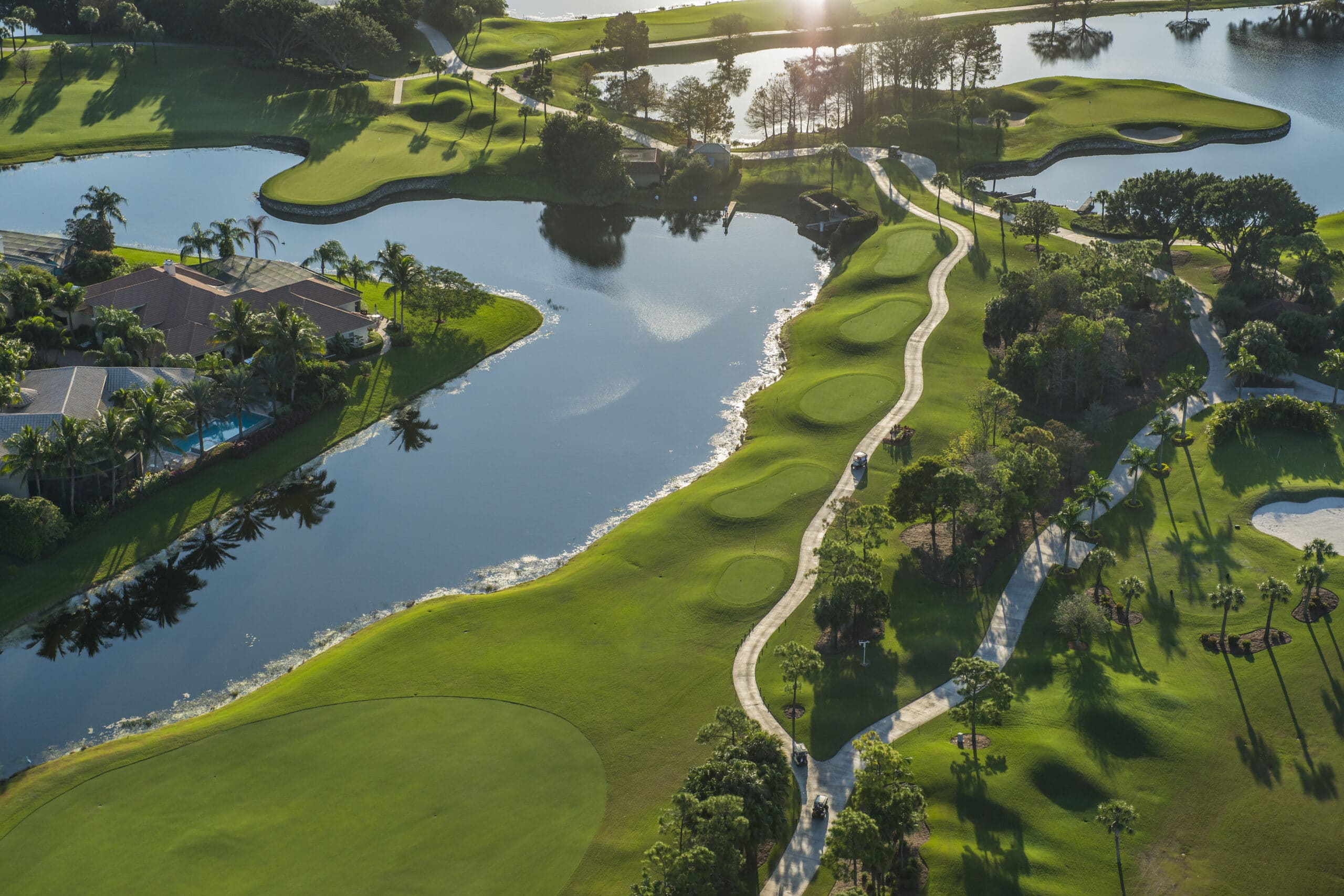 Luxury Golf Course Estates Palm Beach County Elegant estate home overlooking manicured fairways in a private golf community in Palm Beach County